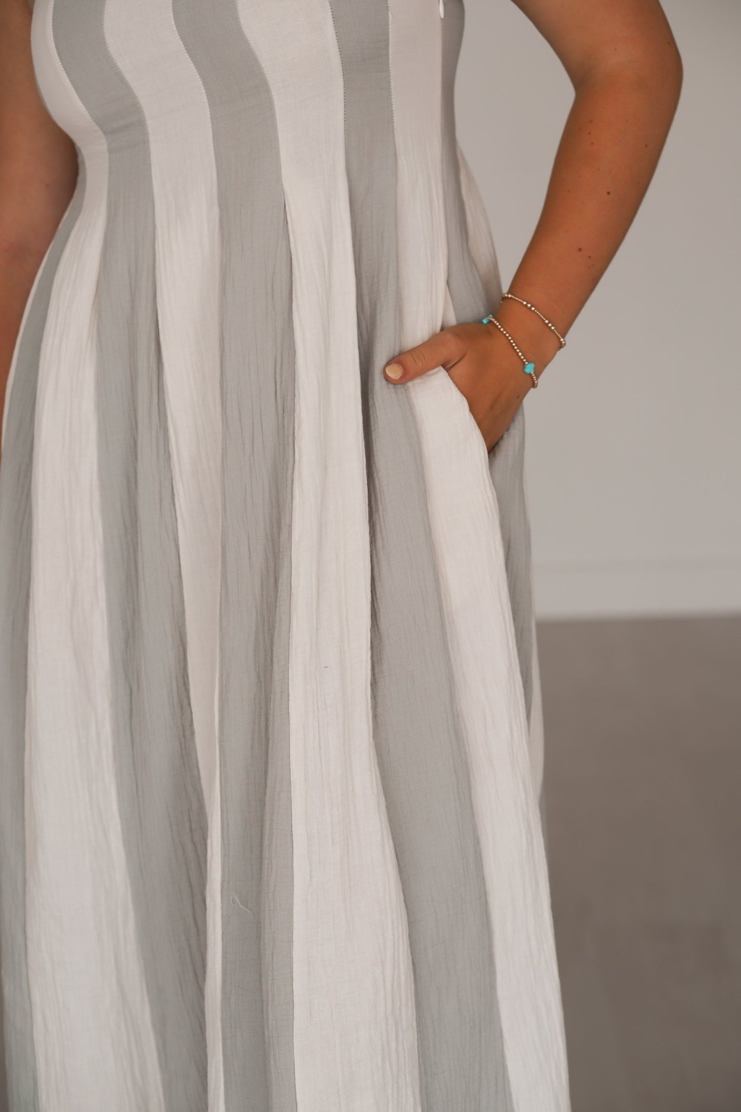 Up close of the striped pattern and the pockets