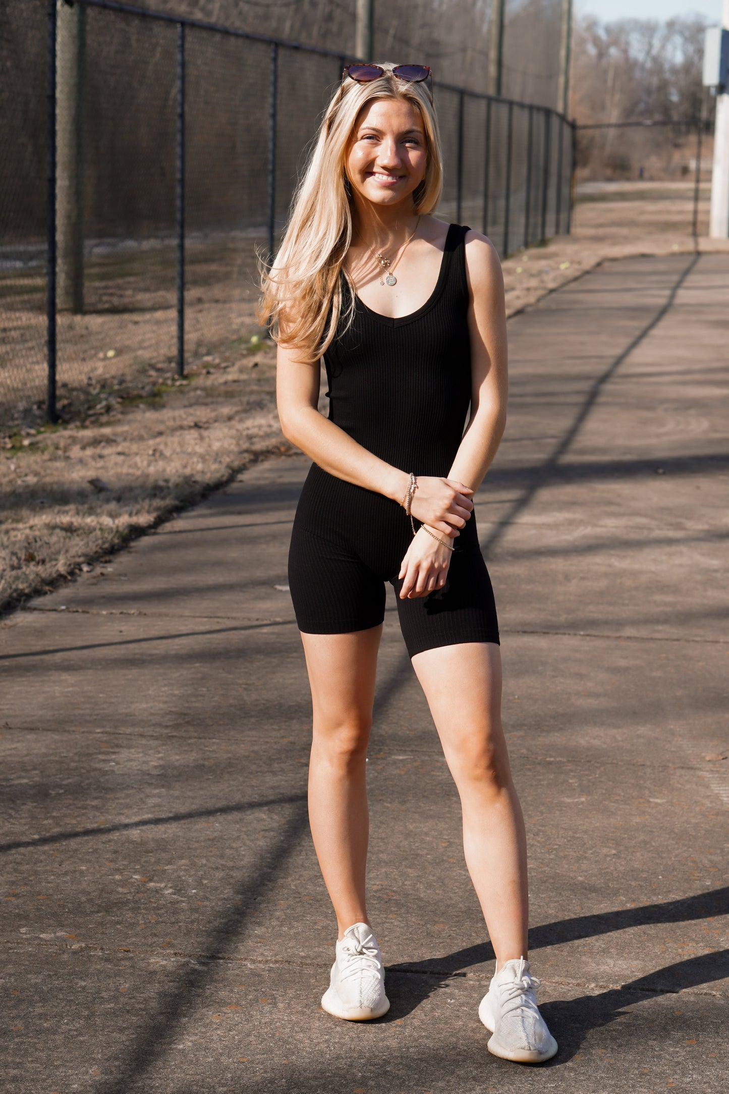 girl wearing a ribbed thick strap onesie