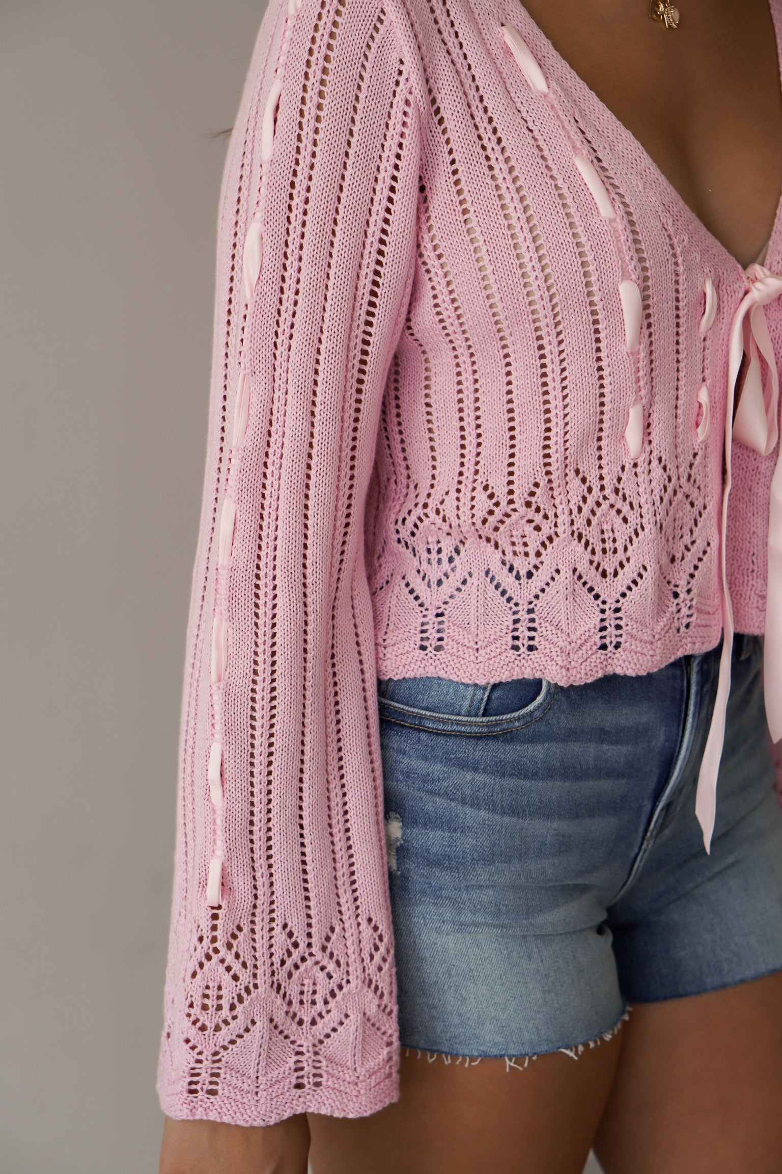 Up close of the detailing on the pink crocheted top 