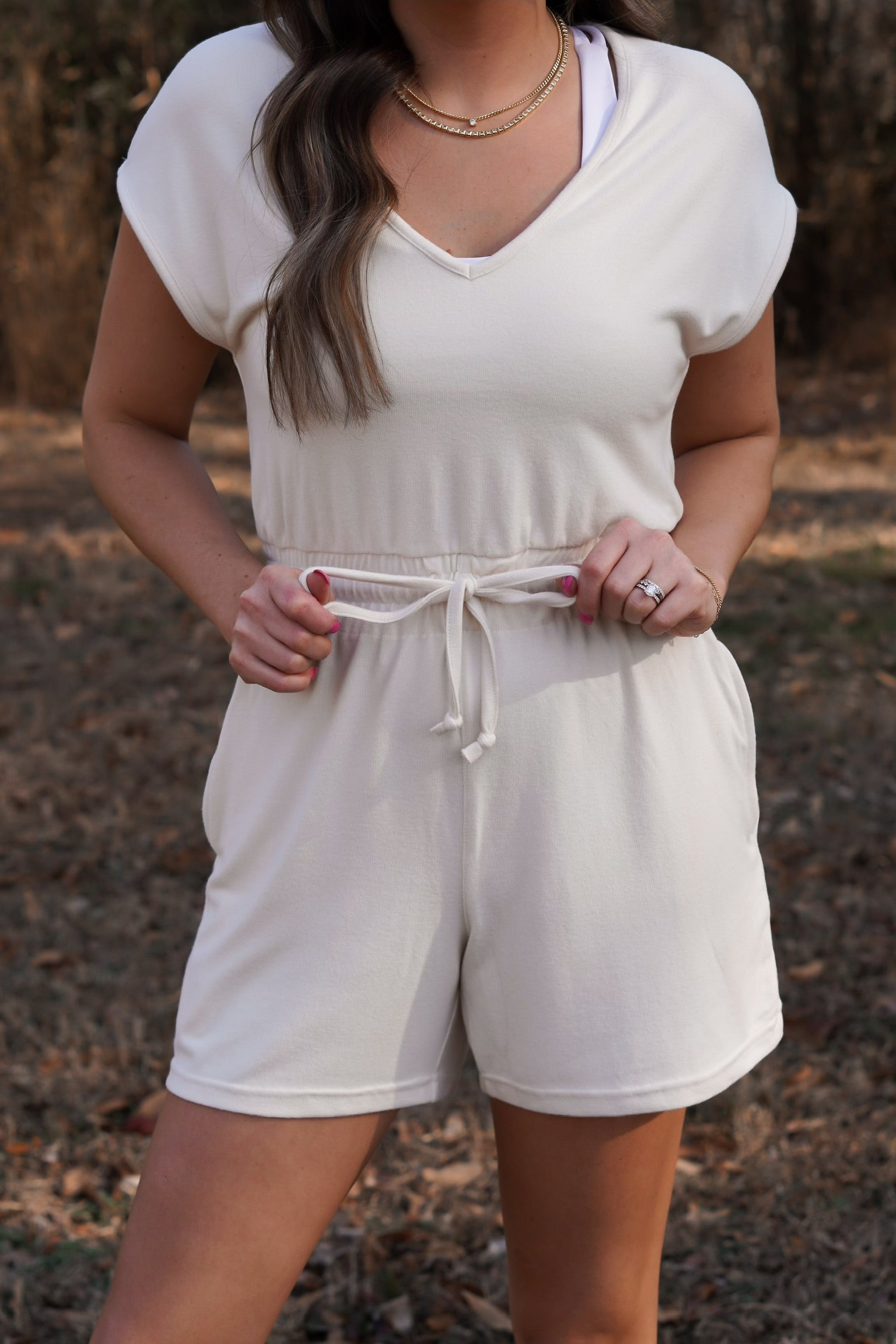 close up picture of the drawstring waistband romper with v-neck 